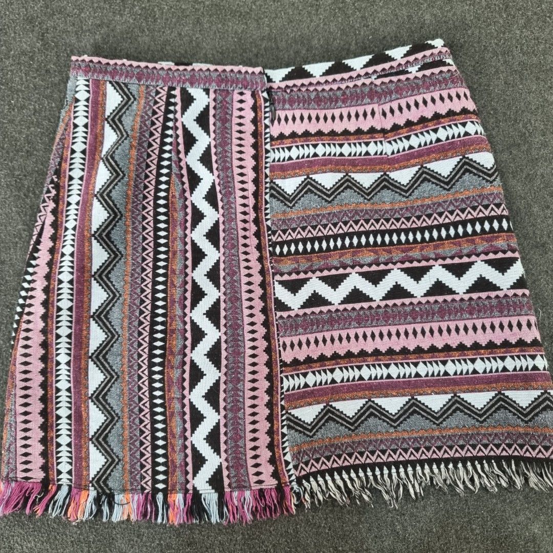 Dotti Aztec Print Woven Skirt Size 10 (Category: Skirts) located in Las Pinas. Submitted by 2nd_soul (Listing ID 1467906673, Image 1). Description: Boho style skirt from Dotti. Size 10 tag inside. Features a colourful Aztec geometric woven pattern with pink, black, grey, and orange tones. Fringe trim along the edge. Zip closure in the back with black lining. Dotti Aztec Jacquard Mini Skirt, featuring a vibrant, multicolored geometric design, a sp