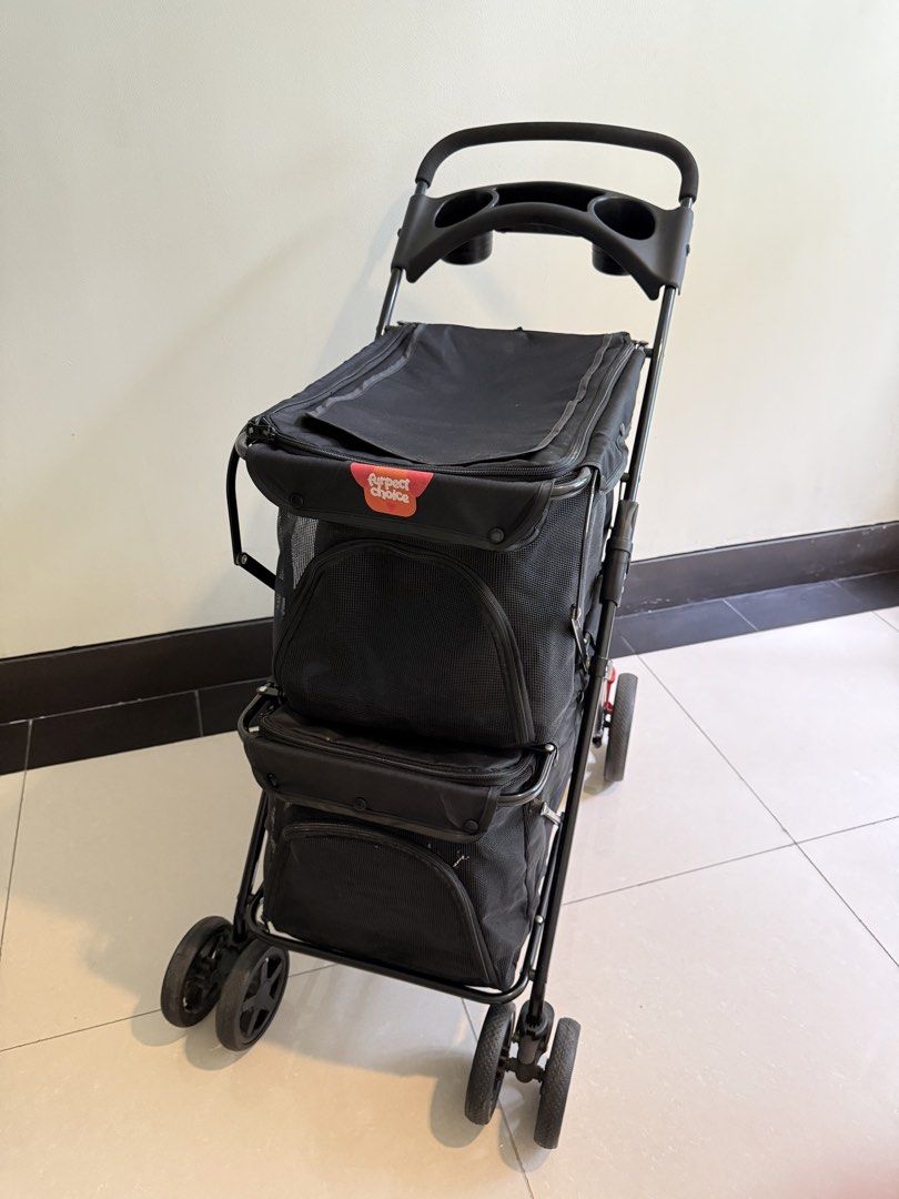 Double Decker Pet Stroller Black (Category: Homes & Other Pet Accessories) located in Quezon City. Submitted by bamsyyyyy (Listing ID 1467887403, Image 3). Description: - Color: Solid Black - Design: Double-decker with two compartments for multiple small dogs or cats - Comfort & Safety: Breathable mesh windows and secure zipper closures - Convenience: Handlebar with built-in cup holder tray and under-seat storage basket - Mobility: Foldable metal