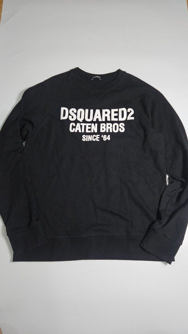 DSQUARED2 Black Caten Bros Since 64 Sweatshirt (Category: Coats, Jackets and Outerwear) located in Alfonso. Submitted by jbcamet (Listing ID 1467980118, Image 1). Description: - Brand: DSQUARED2 - Color: Classic Black - Design: Bold white 'DSQUARED2 CATEN BROS SINCE 64' front print - Interior: Cozy and warm fleece lining - Details: Crewneck with ribbed collar, cuffs, and hem - Origin: Made in China (DSQUARED2 HOME inner tag) - Condition: Great fo