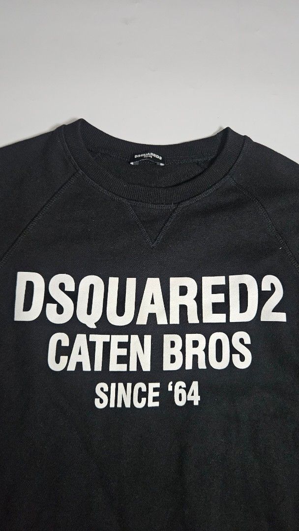 DSQUARED2 Black Caten Bros Since 64 Sweatshirt (Category: Coats, Jackets and Outerwear) located in Alfonso. Submitted by jbcamet (Listing ID 1467980118, Image 2). Description: - Brand: DSQUARED2 - Color: Classic Black - Design: Bold white 'DSQUARED2 CATEN BROS SINCE 64' front print - Interior: Cozy and warm fleece lining - Details: Crewneck with ribbed collar, cuffs, and hem - Origin: Made in China (DSQUARED2 HOME inner tag) - Condition: Great fo