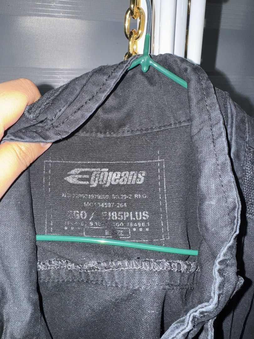 Egojeans Black Utility Jacket Military Style (Category: Coats, Jackets and Outerwear) located in La Trinidad. Submitted by prelovedandfindsbyji (Listing ID 1467930899, Image 3). Description: - Brand: Egojeans - Color: Black - Material: Sturdy cotton fabric - Design: Stand collar with button strap, full front zip - Pockets: Multiple chest pockets with cross logo hardware and zippered lower pockets - Size: Tag size 50 / F185PLUS - Style: Perfect la