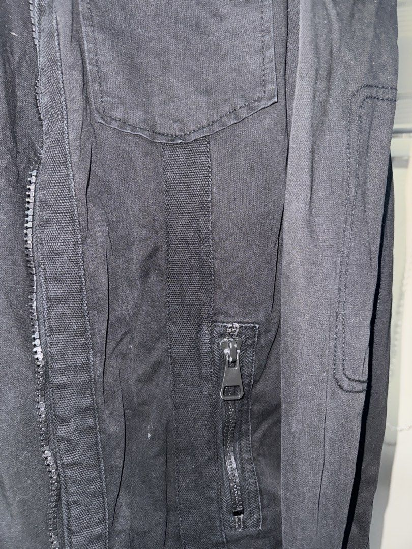 Egojeans Black Utility Jacket Military Style (Category: Coats, Jackets and Outerwear) located in La Trinidad. Submitted by prelovedandfindsbyji (Listing ID 1467930899, Image 2). Description: - Brand: Egojeans - Color: Black - Material: Sturdy cotton fabric - Design: Stand collar with button strap, full front zip - Pockets: Multiple chest pockets with cross logo hardware and zippered lower pockets - Size: Tag size 50 / F185PLUS - Style: Perfect la