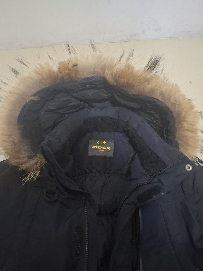 Eider Down Parka with Fur Hood (Category: Babies & Kids Fashion) located in Imus. Submitted by maggieforce (Listing ID 1467921851, Image 3). Description: - size 120 on tag - Brand: Eider - Color: Black - Insulation: Thick down for maximum warmth - Hood: Large with fluffy brown faux fur trim - Pockets: Multiple front utility pockets with snap buttons and zippers - Cuffs: Ribbed inner cuffs to block the wind - Details: Branded logo on chest and sho