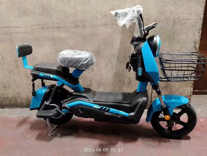 Electric Scooter E-Bike with Basket and Backrest (Category: Bicycles) located in Manila. Submitted by idealtoys (Listing ID 1467862759, Image 2). Description: - Electric scooter with functional front wire basket - Dual seating setup with padded rear passenger seat and backrest support - Integrated pedals included for hybrid manual riding - Stable center kickstand setup for easy parking - Handlebars wrapped in protective plastic - Available colorw
