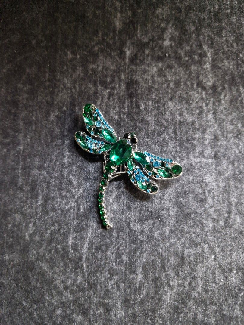 Emeralds Dragonfly Brooch (Category: Brooches) located in Taguig. Submitted by mommaschoice (Listing ID 1467939967, Image 1). Description: Brand new Unisex use Adorned w/ mix colored rhinestones Lightweight won't damage the fabric Ships nationwide.
