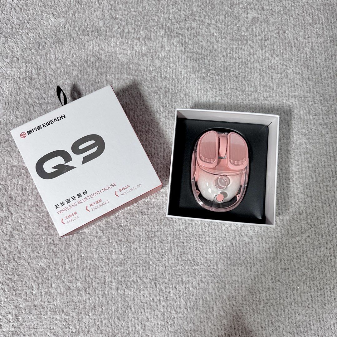 EWEADN Q9 Wireless Bluetooth Mouse Peach (Category: Mouse & Mousepads) located in Paranaque City. Submitted by hershey_august (Listing ID 1467901412, Image 2). Description: - Model: EWEADN Q9 Wireless Bluetooth Mouse - Color: Aesthetic Pink & White - Design: Trendy transparent shell with textured buttons and scroll wheel - Features: Bottom power switch, DPI adjustment button, and smooth blue gliding pads - Inclusion: Comes with original retail bo
