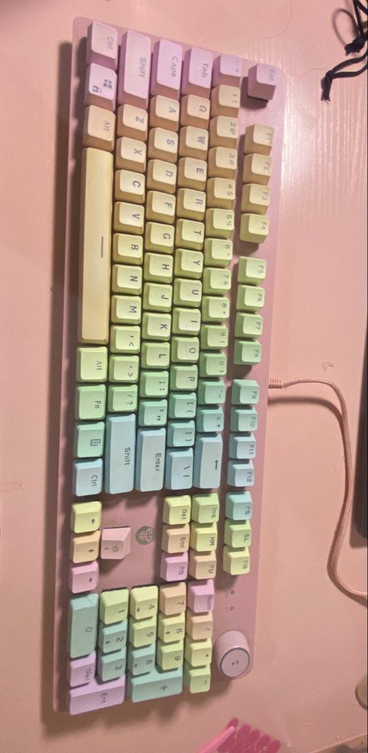 Fantech Pastel Rainbow Mechanical Keyboard (Category: Computer Keyboard) located in Manila. Submitted by deesdeclutter (Listing ID 1467942746, Image 3). Description: - Brand: Fantech mechanical keyboard - Design: Pastel rainbow colorway with pink chassis and yellow, green, blue, and purple keycaps - Layout: Full-size with numpad and convenient volume knob - Connectivity: Includes matching pink braided USB cable - Condition: Works perfectly with b