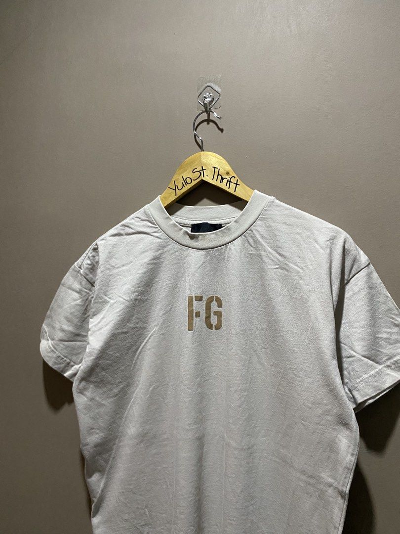 Fear of god (Category: Tshirts & Polo Shirts ) located in Iloilo. Submitted by yulostreet.thrift (Listing ID 1467976920, Image 2). Description: Fear god “FG” Tee Size small on tag Complete tags 20Wx27.5L Best fit M Features a FG spellout print on the chest, material of the print is gamuza. Back rubberized logo seen on the photo. 9.5/10 CR Excellent condition.