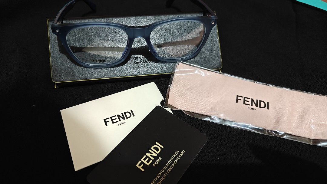 Fendi Blue Eyeglasses Frame FF M0004 (Category: Sunglasses & Eyewear) located in Makati City. Submitted by tbstuff (Listing ID 1467925051, Image 2). Description: - Brand: Fendi - Material: Matte blue acetate - Shape: Classic square - Model / Temple Code: TH711AY6EJ - Lenses: Unworn demo lenses (ideal for prescription or blue light) - Inclusions: Original hard case, cleaning cloth, and authenticity card - Condition: Brand new / Unworn Meet up: Ang