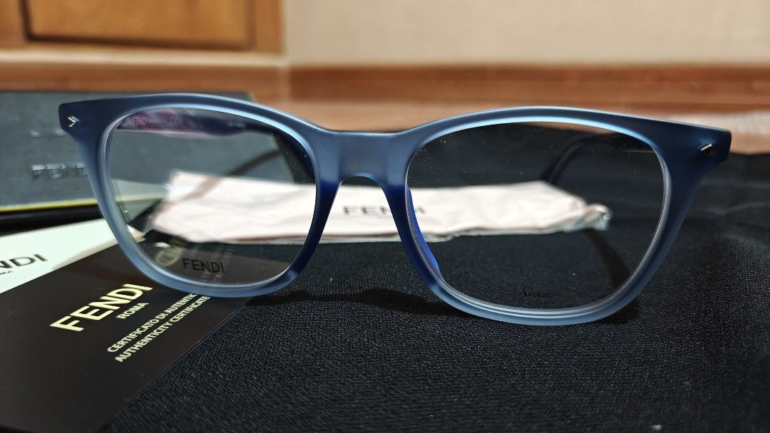 Fendi Blue Eyeglasses Frame FF M0004 (Category: Sunglasses & Eyewear) located in Makati City. Submitted by tbstuff (Listing ID 1467925051, Image 3). Description: - Brand: Fendi - Material: Matte blue acetate - Shape: Classic square - Model / Temple Code: TH711AY6EJ - Lenses: Unworn demo lenses (ideal for prescription or blue light) - Inclusions: Original hard case, cleaning cloth, and authenticity card - Condition: Brand new / Unworn Meet up: Ang