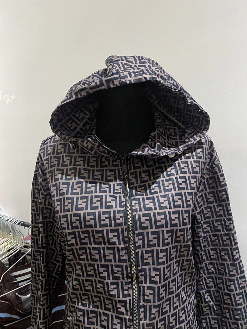 Fendi Zip-Up Hoodie Jacket (Category: Coats, Jackets and Outerwear) located in Manila. Submitted by mpt99876 (Listing ID 1467992150, Image 3). Description: - Style: Zip-up hoodie / light windbreaker - Design: All-over monogram pattern in dark brown and tan - Material: Lightweight fabric for easy layering - Features: Full front zipper, adjustable drawstring hood, long sleeves, elastic cuffs - Fit: Regular fit, great for everyday casual wear.
