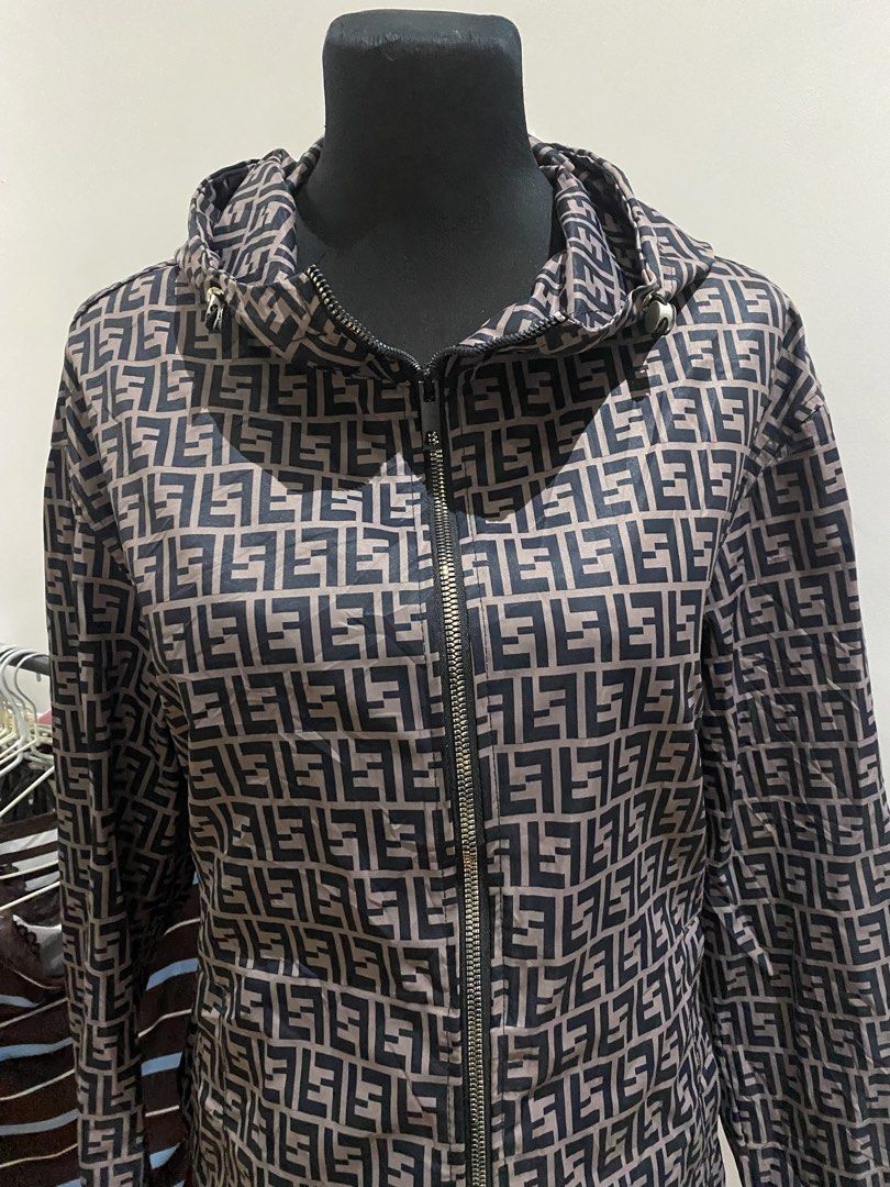 Fendi Zip-Up Hoodie Jacket (Category: Coats, Jackets and Outerwear) located in Manila. Submitted by mpt99876 (Listing ID 1467992150, Image 2). Description: - Style: Zip-up hoodie / light windbreaker - Design: All-over monogram pattern in dark brown and tan - Material: Lightweight fabric for easy layering - Features: Full front zipper, adjustable drawstring hood, long sleeves, elastic cuffs - Fit: Regular fit, great for everyday casual wear.