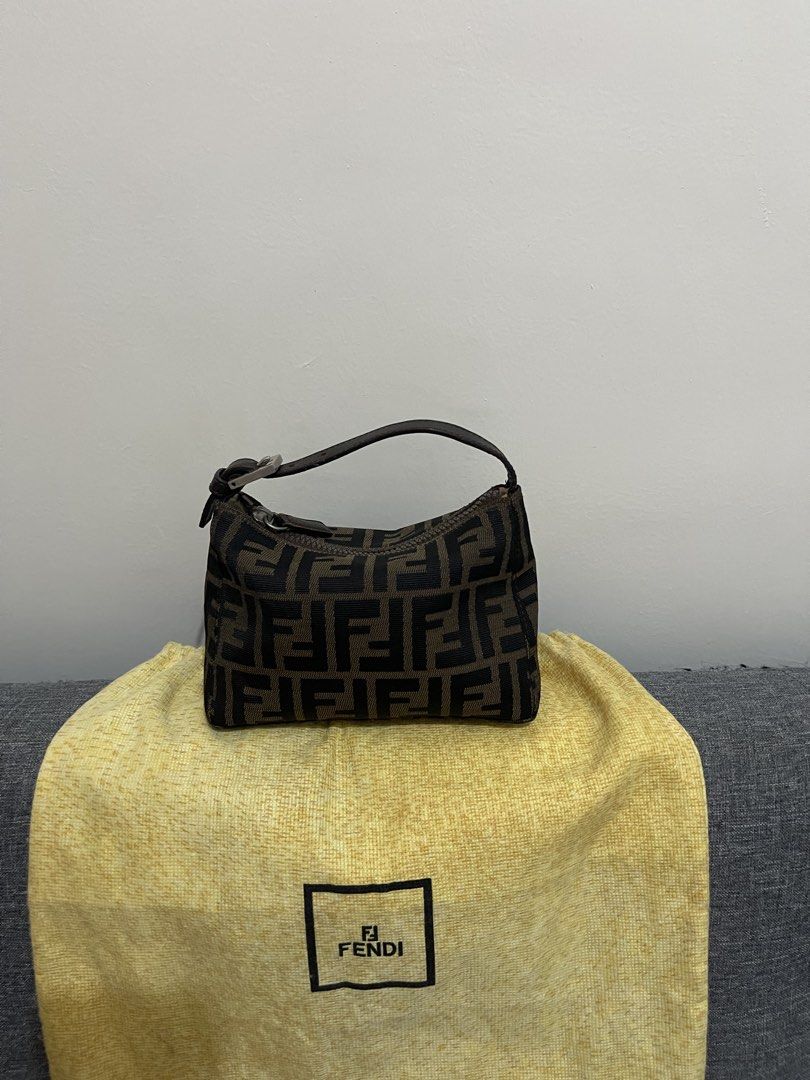 Fendi Zucca Canvas Mini Pochette Handbag (Category: Shoulder Bags) located in Quezon City. Submitted by houseoftrends_ (Listing ID 1467966677, Image 2). Description: - Authentic Classic Fendi Mini Pouch Bag - Brown and black iconic monogram canvas with sturdy structure - Dark brown leather top handle featuring silver-tone buckle hardware - Secure top zip closure - Compact and clean, ideal for carrying everyday essentials - Includes original yello