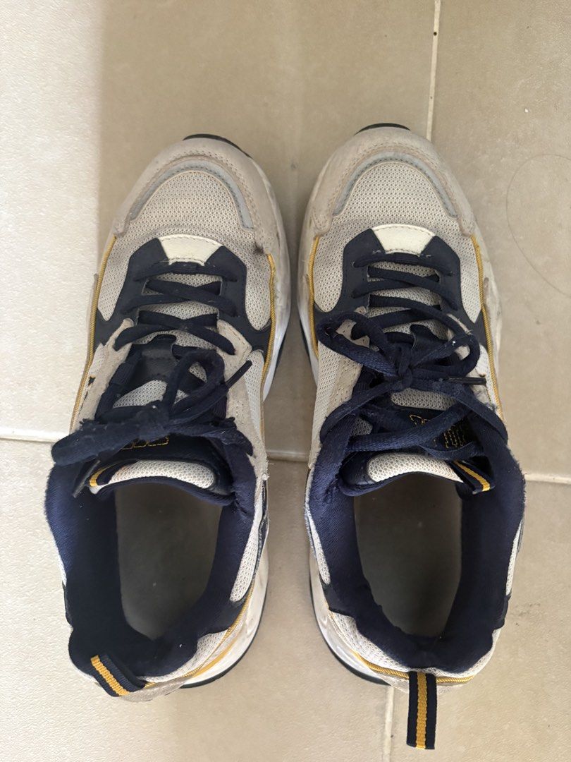 Fila chunky sneakers grey navy yellow (Category: Sneakers) located in Manila. Submitted by loislane112233 (Listing ID 1467927557, Image 2). Description: - Brand: Fila - Style: Retro chunky dad shoes - Colorway: Grey, navy, and yellow with navy blue laces and inner lining - Materials: Premium mesh and suede upper panels with thick rubber midsole - Features: Embroidered Fila logo on the side, extra cushioning, and added height - Condition: Excellen