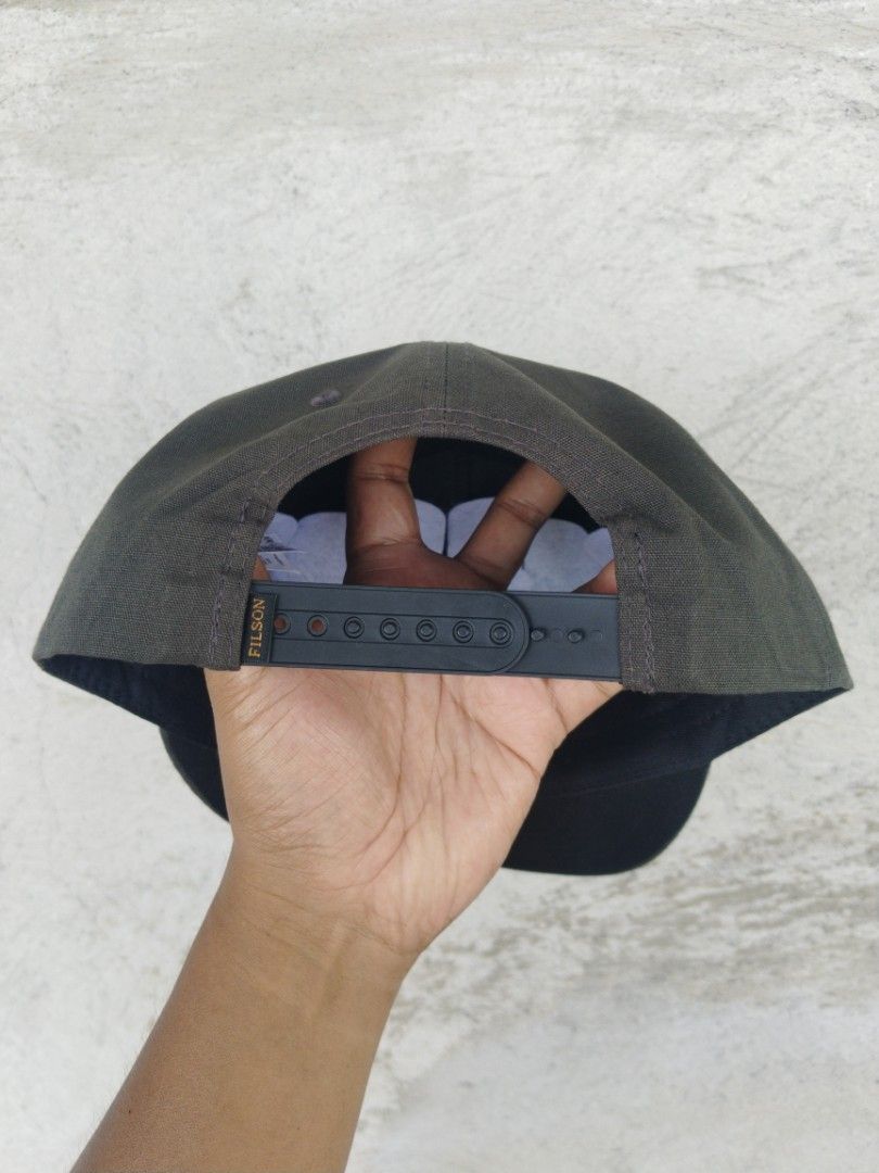 Filson snapback (Category: Caps & Hats) located in Legazpi City. Submitted by genobecollectives (Listing ID 1467980612, Image 2). Description: Filson 1200 free ship - Color: Dark Green - Design: Classic C.C. Filson Co. Seattle Wash graphic on front - Material: 100% cotton shell (Made in Bangladesh) - Fit: Adjustable plastic snapback strap with Filson branding - Care: Spot clean only - Condition: Clean inside and out, well-maintained.