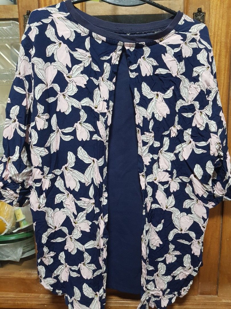 For Me Navy blue floral top (Category: Longsleeves) located in Baguio. Submitted by soonshimcart (Listing ID 1467853680, Image 2). Description: - Color: Navy blue with pink and white floral pattern - Design: Layered from opening with solid dark blue inner fabric - Features: Long sleeves, comfortable crew neckline - Material: Soft and comfortable fabric - Condition: Great casual piece for everyday wear.