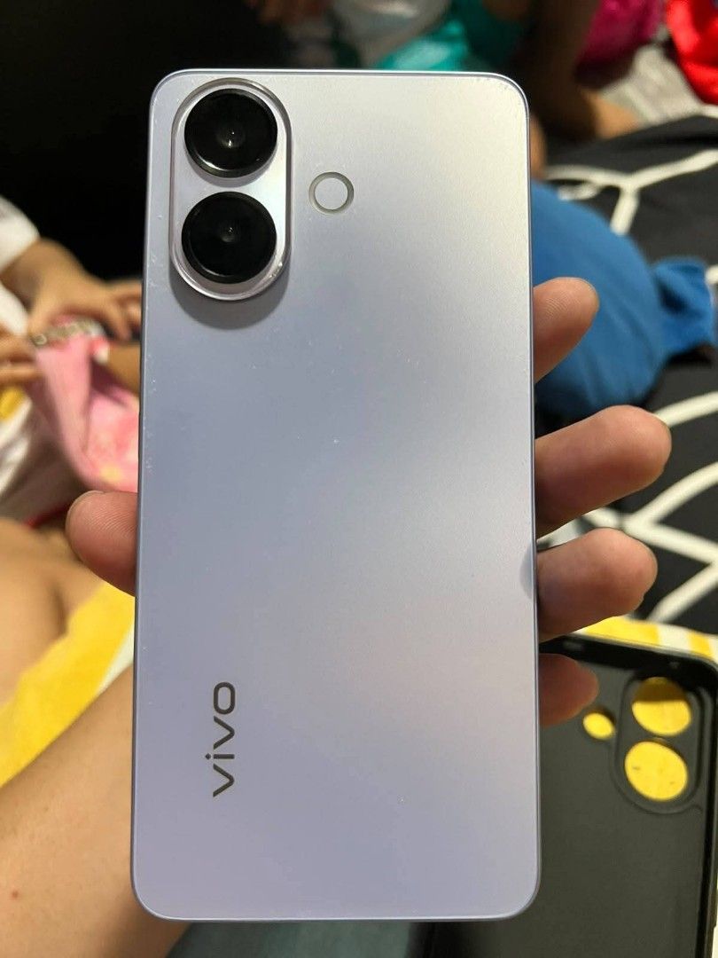 For Sale (Category: Vivo) located in Manila. Submitted by jeckztar26 (Listing ID 1467844246, Image 1). Description: Screen: 6.77-inch AMOLED flat display with FHD+ resolution (2392 × 1080), 120Hz refresh rate, and up to 3,000 nits peak brightness. Dimensions & Weight: 163.77 × 76.28 × 7.59 mm (Blue/Black) or 7.69 mm (Pink); weighs 194g. Durability: IP65 dust and water resistance rating. Colors: Titanium Blu Performance & Software Processor: Media
