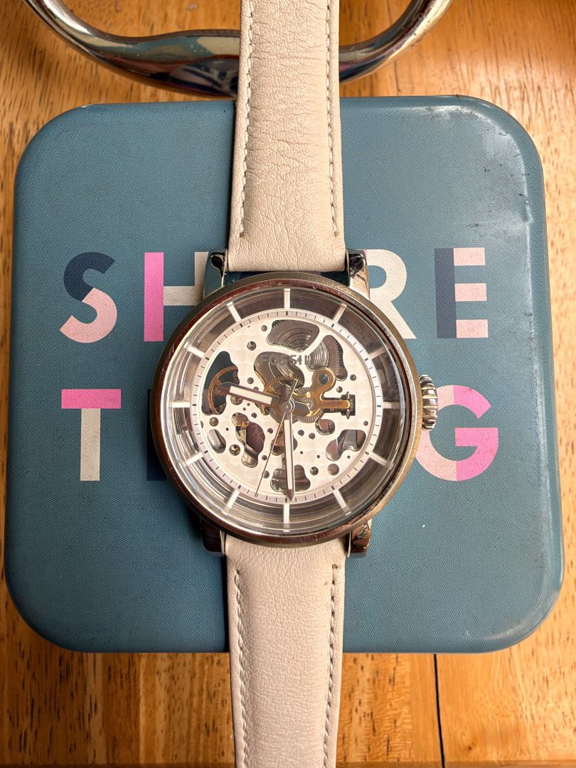 Fossil ME3069 Automatic Skeleton Watch with Beige Leather Strap (Category: Men's Watches) located in Quezon City. Submitted by 30somethingtreasures (Listing ID 1467993835, Image 2). Description: - Brand: Fossil - Model: ME3069 - Movement: Automatic (powered by wrist movement, no battery needed) - Dial: Skeleton dial with a clear view of mechanical gears from front and back - Case: Stainless steel with rose gold tone accents - Strap: Genuine beige