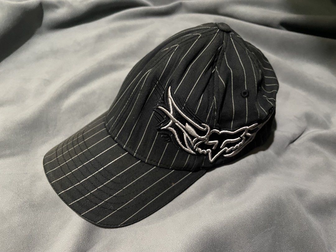 Fox Racing Pinstripe Flexfit Cap (Category: Caps & Hats) located in Baguio. Submitted by elayor3 (Listing ID 1467861860, Image 1). Description: - Brand: Fox Racing - Style: Pinstripe Flexfit Cap with detailed side embroidery - Color: Black with white pinstripes - Size: L/XL (Flexfit technology) - Material: 98% Cotton, 2% P.U. Spandex - Origin: Made in Vietnam - Condition: Excellent pre-owned condition, well-maintained.