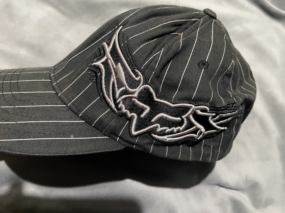 Fox Racing Pinstripe Flexfit Cap (Category: Caps & Hats) located in Baguio. Submitted by elayor3 (Listing ID 1467861860, Image 2). Description: - Brand: Fox Racing - Style: Pinstripe Flexfit Cap with detailed side embroidery - Color: Black with white pinstripes - Size: L/XL (Flexfit technology) - Material: 98% Cotton, 2% P.U. Spandex - Origin: Made in Vietnam - Condition: Excellent pre-owned condition, well-maintained.