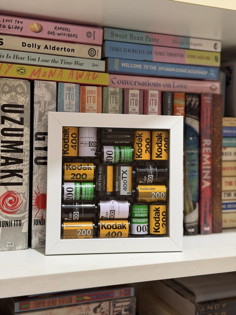 Framed 35mm Film Canisters (Category: Art & Prints) located in Quezon City. Submitted by wordsbymiss.r (Listing ID 1467979980, Image 1). Description: Decluttering ❗️ - handmade, bought from The Film Cartel - recycled 35mm film canisters (Kodak, Fujifilm, Portra, and 400TX) - white shadow box frame with glass front - square in size - sawtooth hanger on the back for wall mounting - for display only 📍 sampaloc, manila 💵 bank transfer/ maribank/ go