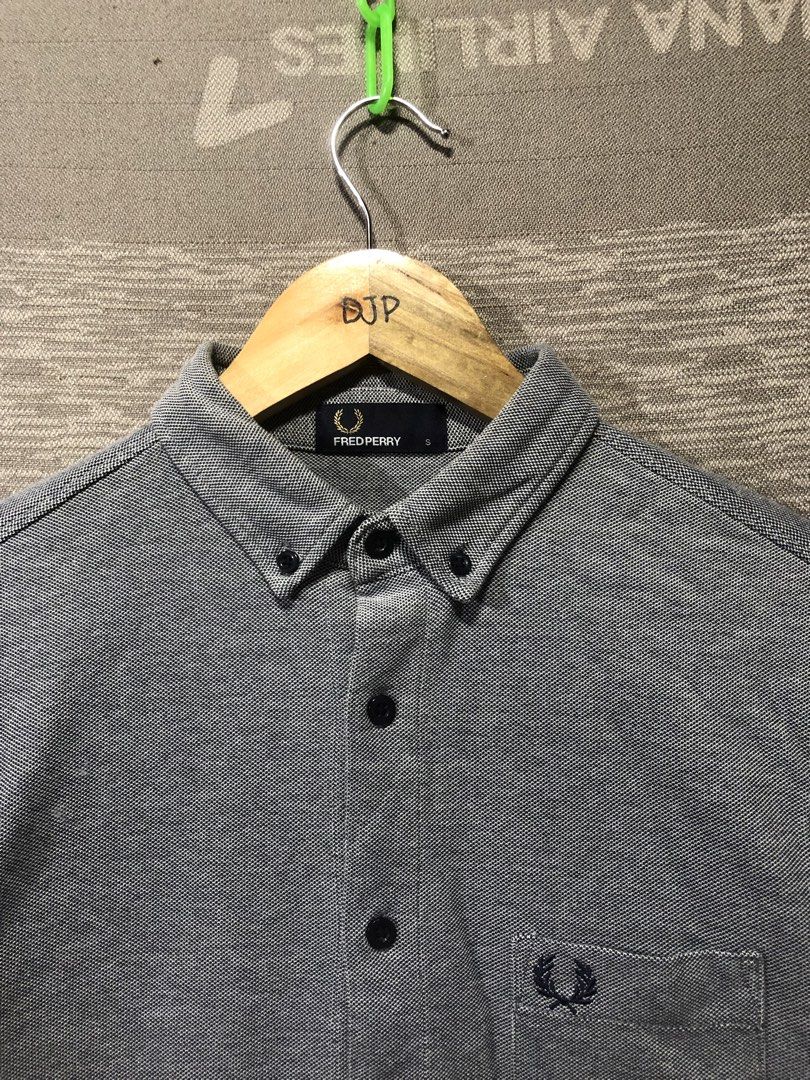 Fred Perry grey long sleeve button-down shirt size S (Category: Formal Shirts) located in Digos. Submitted by villasurdajayvee (Listing ID 1467997007, Image 2). Description: - Brand: Fred Perry - Item: Long sleeve button-down shirt - Size: Small - Color: Grey - Fit: Regular fit - Details: Button-down collar, chest pocket with embroidered laurel wreath logo, dark buttons on front and cuffs - Origin: Made in China - Condition: Great everyday casual