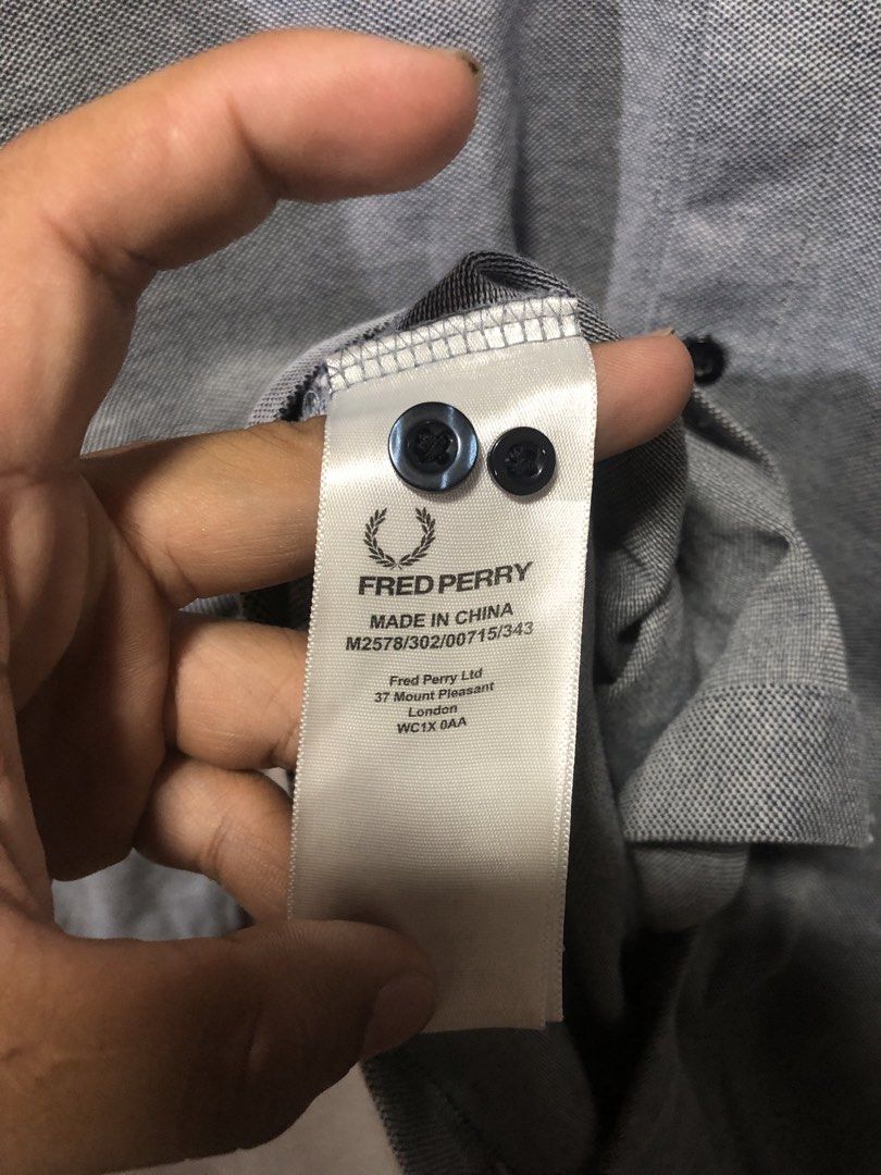 Fred Perry grey long sleeve button-down shirt size S (Category: Formal Shirts) located in Digos. Submitted by villasurdajayvee (Listing ID 1467997007, Image 3). Description: - Brand: Fred Perry - Item: Long sleeve button-down shirt - Size: Small - Color: Grey - Fit: Regular fit - Details: Button-down collar, chest pocket with embroidered laurel wreath logo, dark buttons on front and cuffs - Origin: Made in China - Condition: Great everyday casual