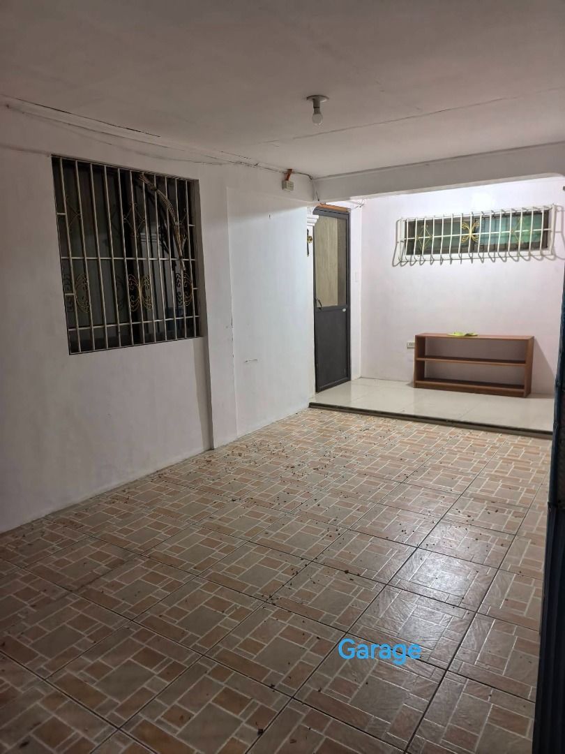 House for Rent (Category: House & Lot) located in Pasig City. Submitted by dzeims (Listing ID 1467880136, Image 2). Description: House available for rent, featuring multiple rooms with beds and air conditioning units. Includes bathrooms with tiled walls, sinks, and toilets. Outside features a secured front gate with stone detailing and house number 9. Tiled flooring throughout the interior rooms and bathrooms. Unit Details: - 130 sqm - Fully furn