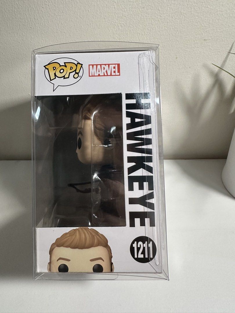 Funko Pop Marvel Hawkeye 1211 Vinyl Figure (Category: Figurines & Statues) located in Cabanatuan. Submitted by s.kit.27 (Listing ID 1468020353, Image 2). Description: - Item: Hawkeye Vinyl Figure (#1211, Disney Plus series) - Condition: Clean box with minor shelf wear - Inclusion: Comes with original window box and free plastic protector case - Perfect for Marvel fans and Funko collectors - Trusted Carousell seller, message for inquiries or fast 