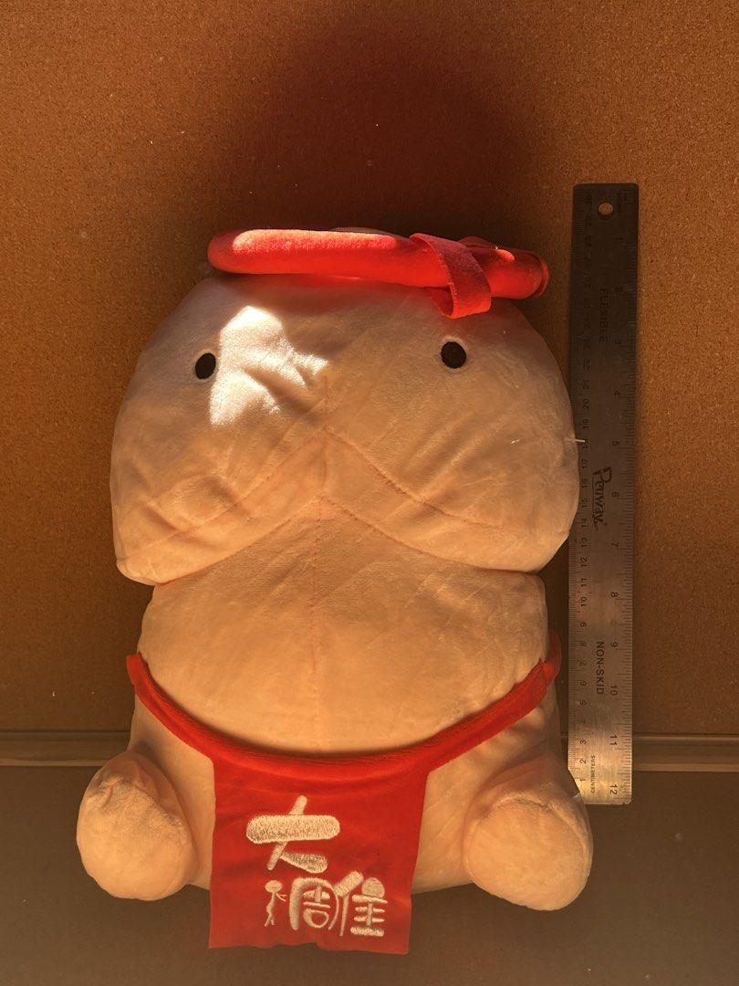 Funny Sumo Wrestler Plush Toy Stuffed Doll (Category: Plushies & Soft Toys) located in Baguio. Submitted by gaara1234 (Listing ID 1467869476, Image 1). Description: - Novelty sumo wrestler plush toy - Measures approximately 12 inches tall - Made with soft peach-colored fabric and embroidered Japanese characters - Features a red mawashi belt, stitched facial features, and a matching headband - Clean material with durable stitching throughout - Per