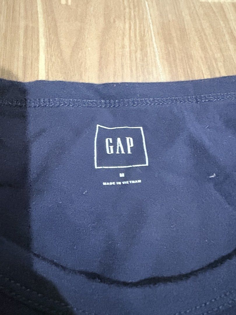 GAP Blue Logo T-Shirt Size M (Category: Tshirts & Polo Shirts ) located in Manila. Submitted by thriftwithgem (Listing ID 1467899528, Image 2). Description: - Brand: GAP - Color: Blue with large white logo - Size: Medium - Material: Soft cotton - Condition: Great everyday basic, smoke-free home - Origin: Made in Vietnam.