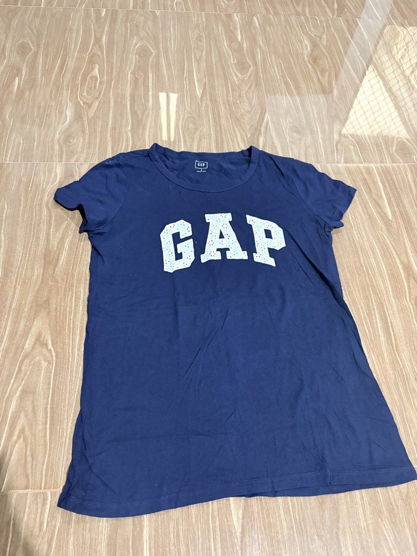 GAP Blue Logo T-Shirt Size M (Category: Tshirts & Polo Shirts ) located in Manila. Submitted by thriftwithgem (Listing ID 1467899528, Image 1). Description: - Brand: GAP - Color: Blue with large white logo - Size: Medium - Material: Soft cotton - Condition: Great everyday basic, smoke-free home - Origin: Made in Vietnam.