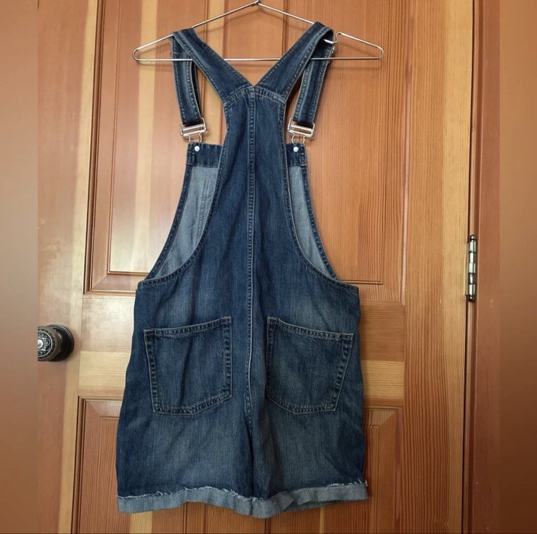 Gap Denim Overalls Shorts Romper (Category: Rompers) located in Pasig City. Submitted by notyouraveragestuff (Listing ID 1467847851, Image 2). Description: - Brand: Gap - Style: Medium wash denim overall shorts - Details: Classic bib front pocket, adjustable straps, metal side buttons, rolled cuffs, and two back pockets - Condition: Excellent pre-loved condition - Perfect for: Casual warm-weather outfits and effortless styling.