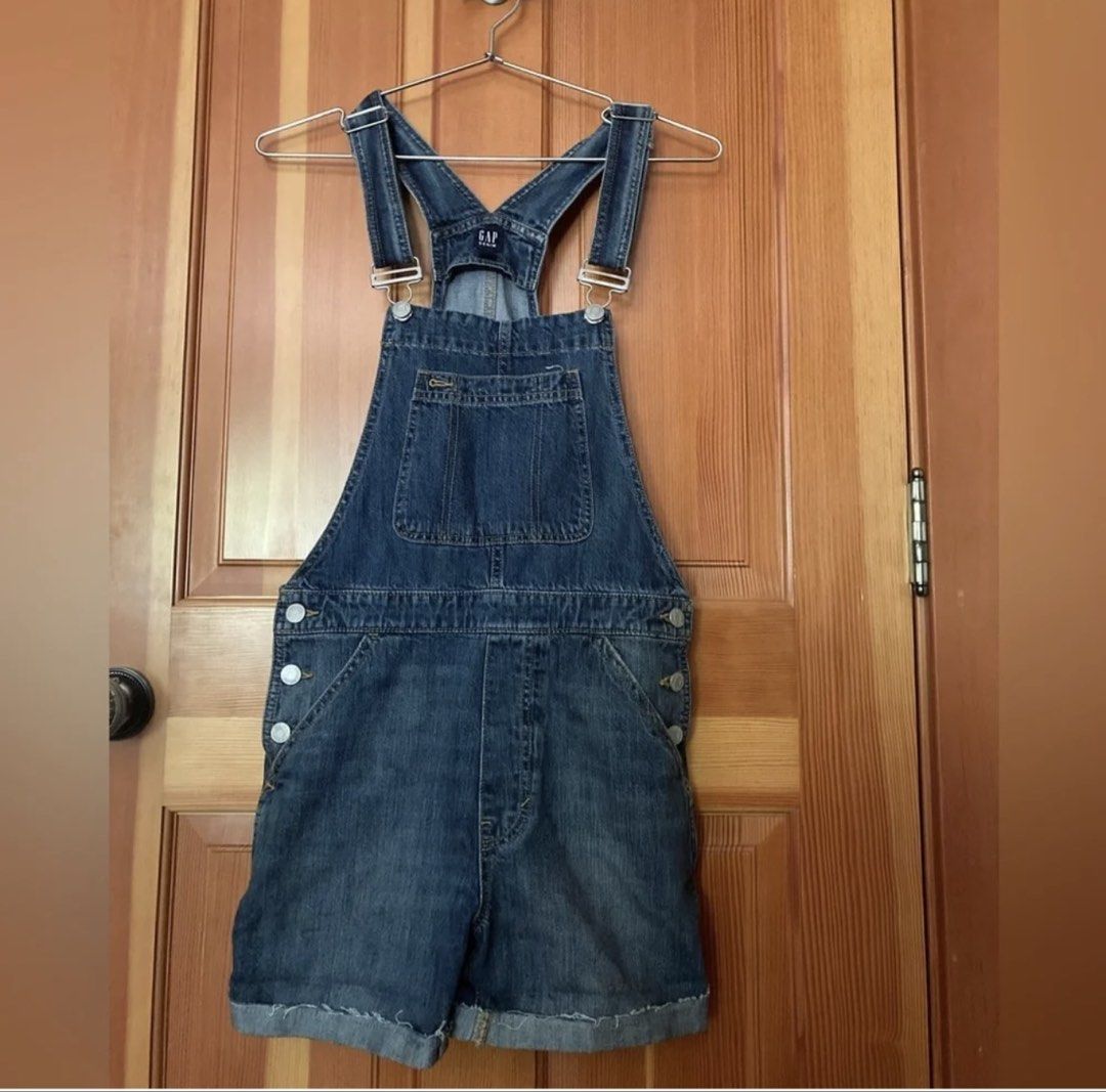 Gap Denim Overalls Shorts Romper (Category: Rompers) located in Pasig City. Submitted by notyouraveragestuff (Listing ID 1467847851, Image 1). Description: - Brand: Gap - Style: Medium wash denim overall shorts - Details: Classic bib front pocket, adjustable straps, metal side buttons, rolled cuffs, and two back pockets - Condition: Excellent pre-loved condition - Perfect for: Casual warm-weather outfits and effortless styling.