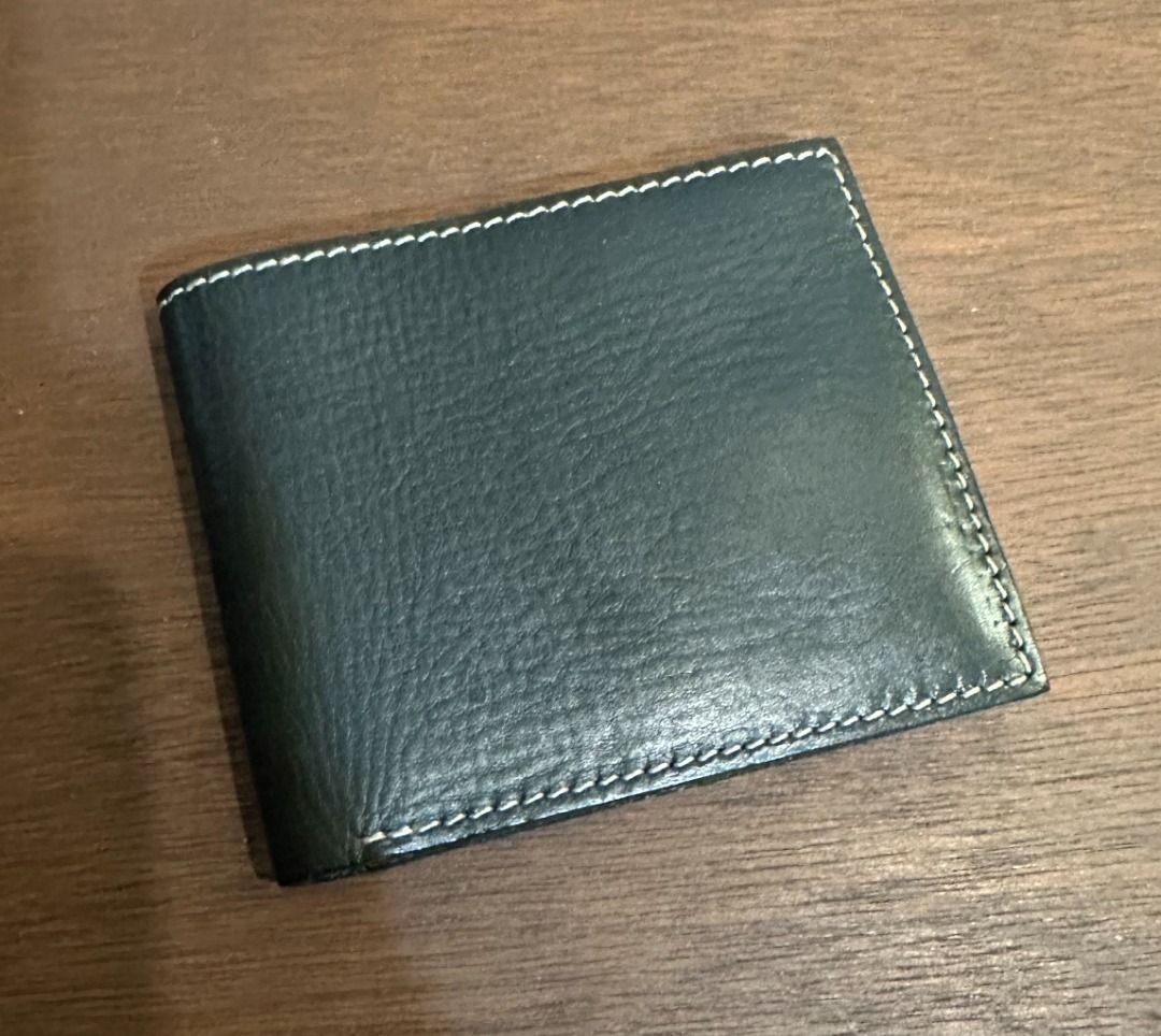 Gap Jeans Black Leather Bifold Wallet (Category: Wallets & Card Holders) located in San Juan City. Submitted by looneyc (Listing ID 1467901428, Image 3). Description: - Brand: Gap Jeans (Est. 1969) - Material: Genuine black leather with clean grain texture - Design: Classic bifold with stylish contrast white stitching - Storage: Multiple card slots on both interior sides and a full-length cash compartment - Branding: Subtle debossed logo stamp on