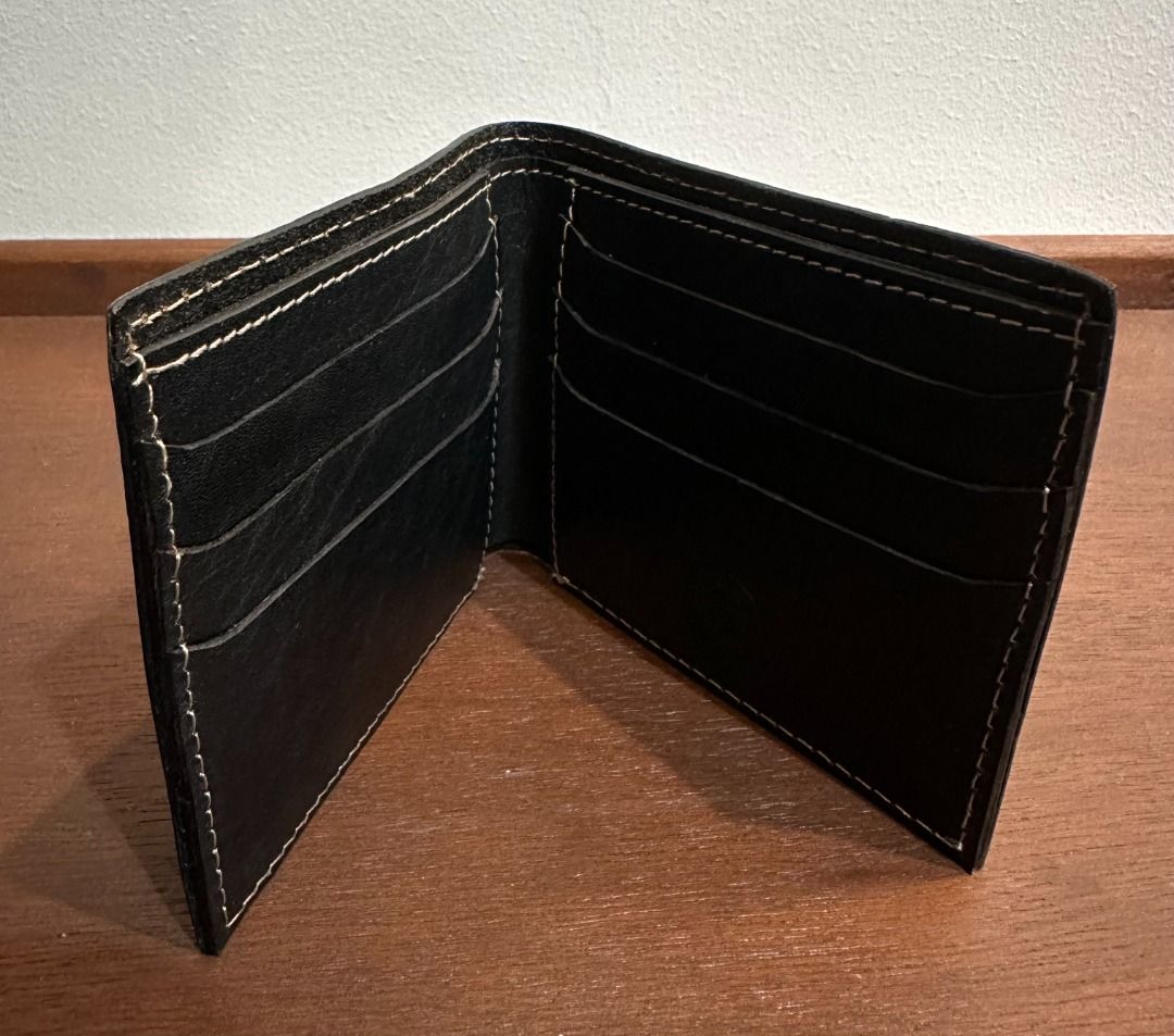 Gap Jeans Black Leather Bifold Wallet (Category: Wallets & Card Holders) located in San Juan City. Submitted by looneyc (Listing ID 1467901428, Image 2). Description: - Brand: Gap Jeans (Est. 1969) - Material: Genuine black leather with clean grain texture - Design: Classic bifold with stylish contrast white stitching - Storage: Multiple card slots on both interior sides and a full-length cash compartment - Branding: Subtle debossed logo stamp on
