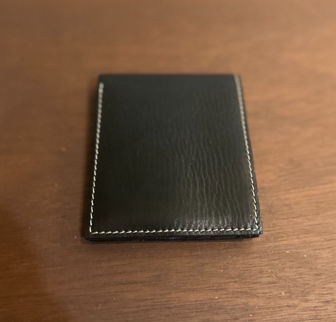 Gap Jeans Black Leather Bifold Wallet (Category: Wallets & Card Holders) located in San Juan City. Submitted by looneyc (Listing ID 1467901428, Image 1). Description: - Brand: Gap Jeans (Est. 1969) - Material: Genuine black leather with clean grain texture - Design: Classic bifold with stylish contrast white stitching - Storage: Multiple card slots on both interior sides and a full-length cash compartment - Branding: Subtle debossed logo stamp on