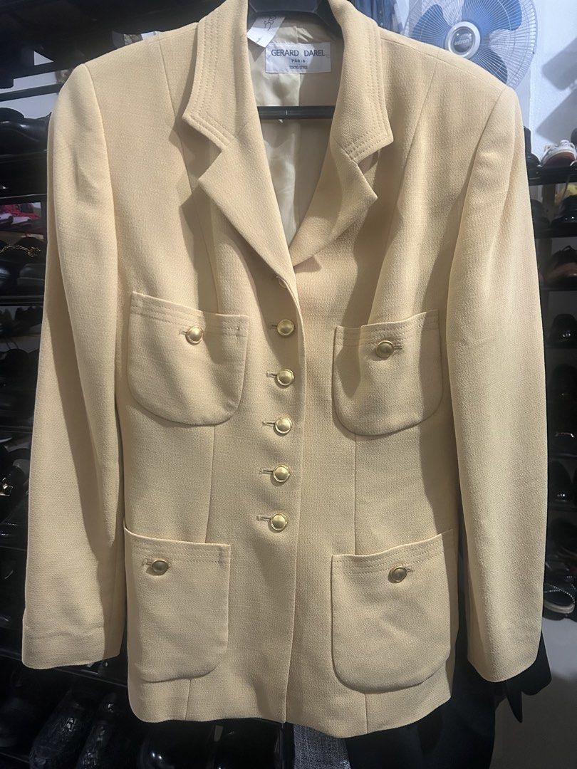 GERARD DAREL PARIS (Category: Coats, Jackets and Outerwear) located in Cavite. Submitted by cecitrifthshop (Listing ID 1467896954, Image 1). Description: This is a vintage pale yellow/beige tailored blazer by the French fashion house Gérard Darel Paris, featuring structured lapels, patch pockets, and ornate gold-tone buttons.