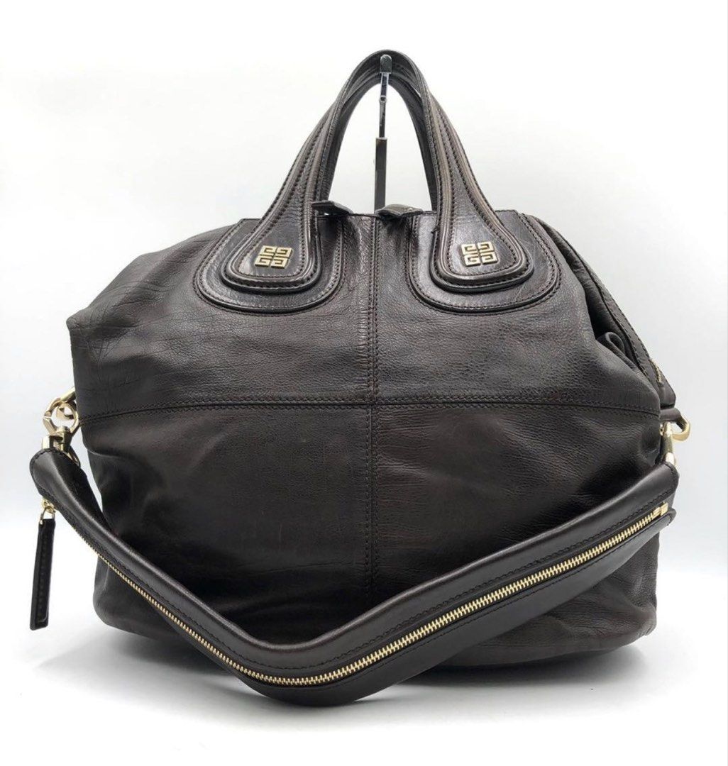 Givenchy Medium Nightingale Dark Brown (Category: Shoulder Bags) located in Las Pinas. Submitted by daisuki_japan_luxury_by_reiko (Listing ID 1468055417, Image 2). Description: ■ Brand: Givenchy ■ Size: Height approx. 31cm x Width approx. 50cm x Depth approx. 18cm, Handle approx. 30cm *Please note that these are amateur measurements taken with a hand-held tape measure, so some errors may occur. ■ Color: Dark Brown ■ Material: Leather ■ Accessorie