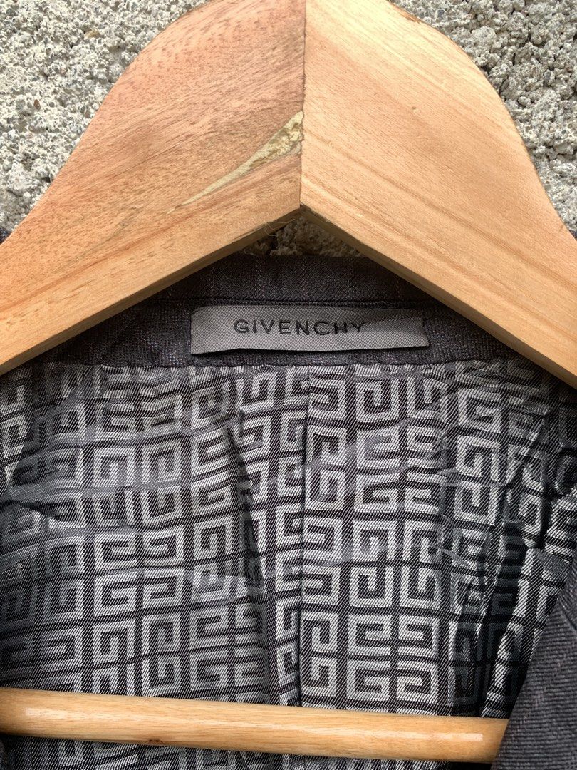 Givenchy Men Pinstripe Blazer Grey Size 39S (Category: Coats, Jackets and Outerwear) located in Manila. Submitted by jeffreyluz31198 (Listing ID 1467926594, Image 2). Description: - Brand: Givenchy - Color: Dark grey with subtle pinstripes - Size: 39S - Features: Double-breasted front, notched lapels, flap pockets, and a striking signature logo-patterned lining - Origin: Made in Korea - Condition: Good, but currently wrinkled from storage and nee