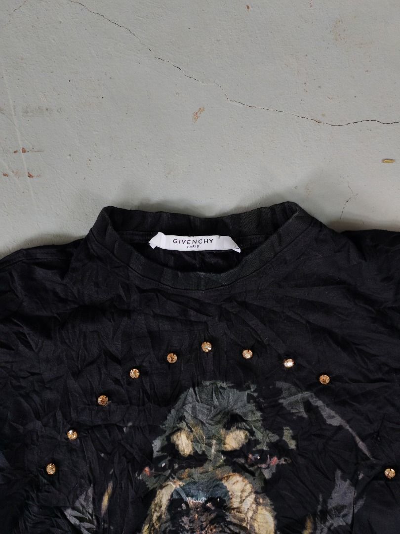Givenchy Rottweiler Graphic T-shirt Size S (Category: Shirts) located in Caloocan City. Submitted by silverbird_6c038f (Listing ID 1467935070, Image 2). Description: - Brand: Givenchy - Color: Black - Size: Small (S) - Material: Standard fit cotton jersey - Design: Iconic Rottweiler graphic on front surrounded by a circular pattern of rhinestone studs and a classic crew neckline - Condition: Good, with slight wrinkles from storage - 100% authenti