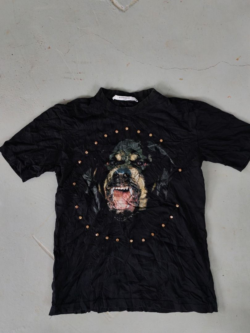 Givenchy Rottweiler Graphic T-shirt Size S (Category: Shirts) located in Caloocan City. Submitted by silverbird_6c038f (Listing ID 1467935070, Image 1). Description: - Brand: Givenchy - Color: Black - Size: Small (S) - Material: Standard fit cotton jersey - Design: Iconic Rottweiler graphic on front surrounded by a circular pattern of rhinestone studs and a classic crew neckline - Condition: Good, with slight wrinkles from storage - 100% authenti