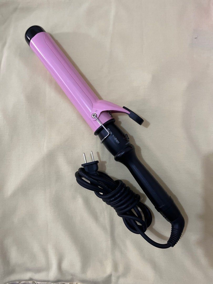 Gladking Pink 38mm Curling Iron (Category: Hair) located in Caloocan City. Submitted by notmichaela (Listing ID 1467905232, Image 1). Description: Please check last photo for technical info. Flaws: may small black marks sa mismong iron nadikit siguro while it’s still hot but does not affect naman its purpose and also fading labels lang. No box na din. Used not more than 5 times, natambak lang talaga so expect dust sa mga malalim na parts. RFS: Hi