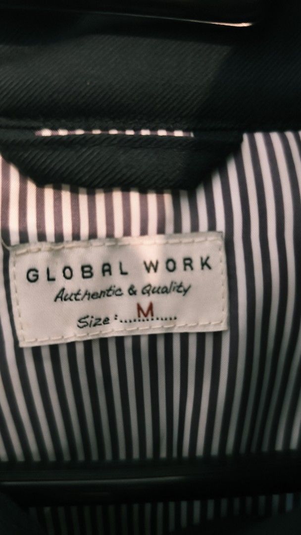 Global Work Black Puffer Jacket Size M (Category: Coats, Jackets and Outerwear) located in Marikina City. Submitted by shopapao (Listing ID 1467898082, Image 3). Description: - Brand: Global Work - Item: Puffer Jacket - Color: Black - Size: M - Design: Front button closure, side pockets, stylish striped inner lining, and high collar with a decorative neck strap - Condition: Warm winter piece; please note that the faux leather on the collar strap 