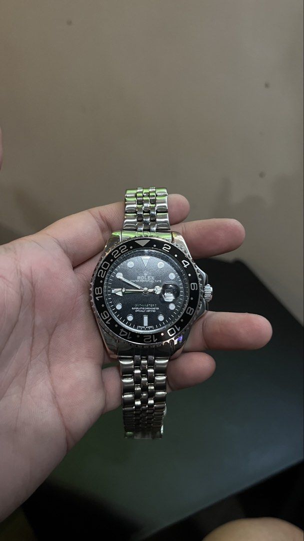 GMT-Master II Automatic Watch Exhibition Caseback (Category: Luxury Watches) located in Manila. Submitted by jreys21 (Listing ID 1467871427, Image 2). Description: GMT-Master II Automatic - Material: Durable stainless steel construction - Dial & Hands: Classic black dial with signature green GMT hand - Bezel: Rotating 24-hour bezel - Bracelet: Comfortable Jubilee-style metal bracelet with secure deployant clasp - Movement: Exhibition caseback sho
