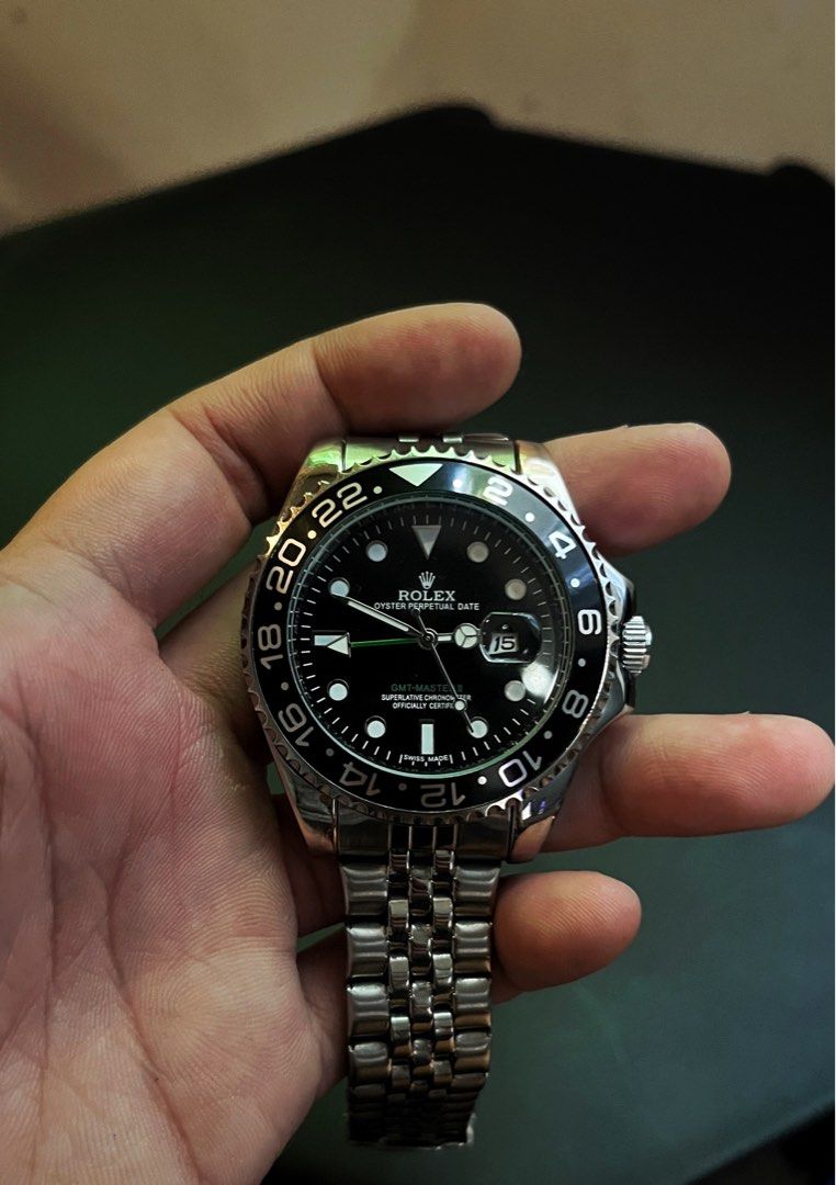 GMT-Master II Automatic Watch Exhibition Caseback (Category: Luxury Watches) located in Manila. Submitted by jreys21 (Listing ID 1467871427, Image 1). Description: GMT-Master II Automatic - Material: Durable stainless steel construction - Dial & Hands: Classic black dial with signature green GMT hand - Bezel: Rotating 24-hour bezel - Bracelet: Comfortable Jubilee-style metal bracelet with secure deployant clasp - Movement: Exhibition caseback sho