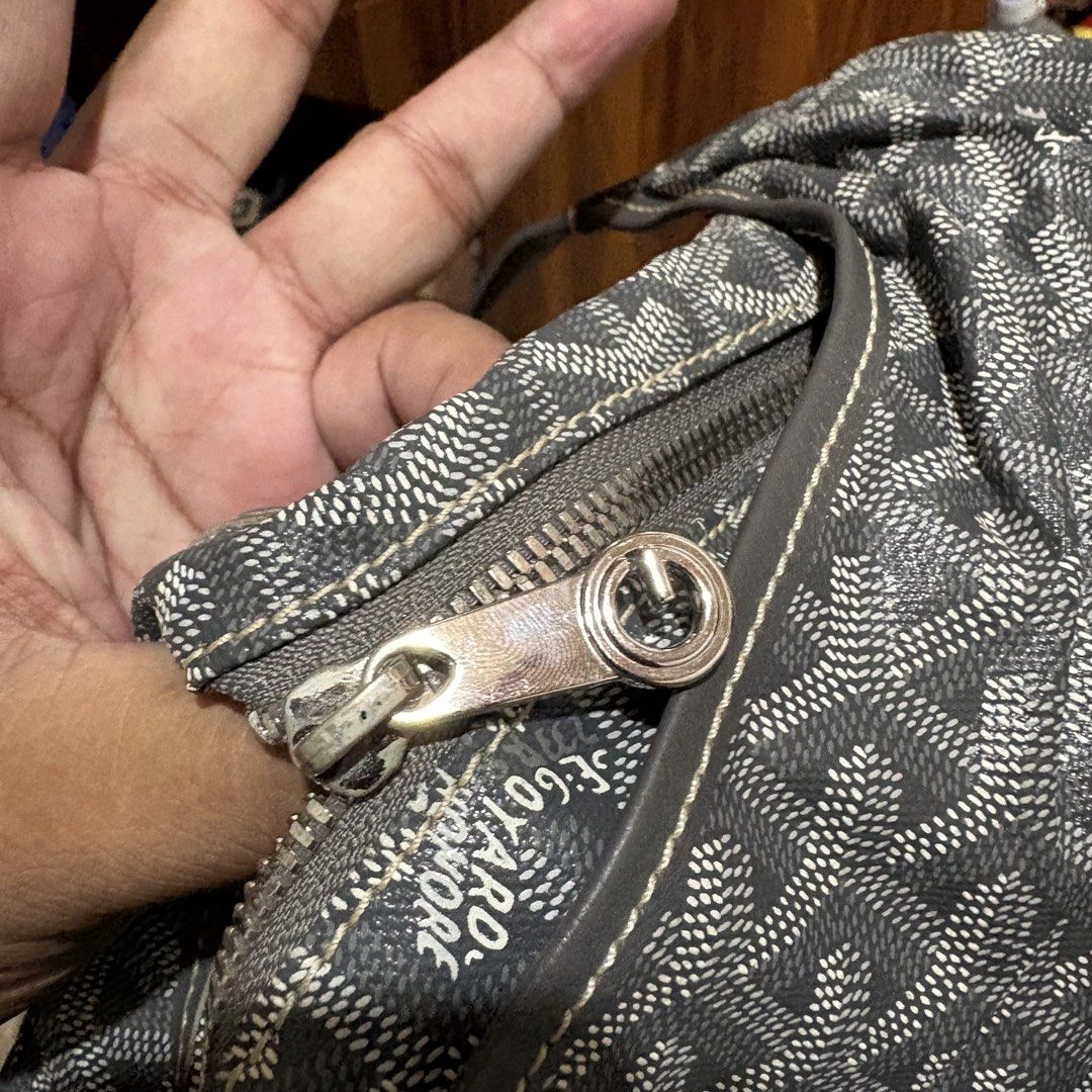 Goyard Gray Shoulder Bag (Category: Luxury Bags & Wallets) located in Carmen. Submitted by rr_thrifts (Listing ID 1467910266, Image 3). Description: Gray Goyard shoulder bag with classic chevron canvas print. Single strap design with top zipper closure. Serial number stamped on the interior leather tab reads MAE 020226. Silver tone hardware with some tarnishing on the zipper pull. Spacious interior lined in matching patterned fabric..