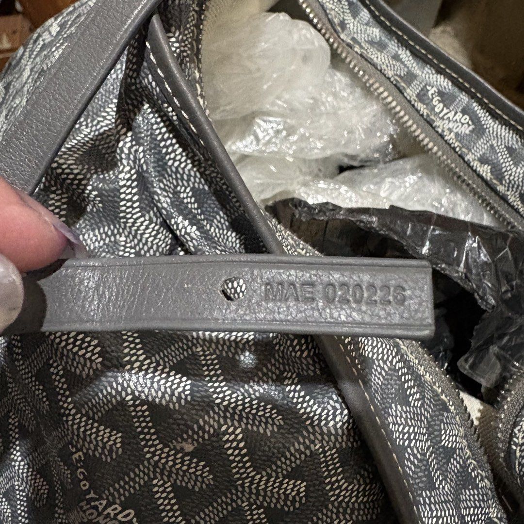 Goyard Gray Shoulder Bag (Category: Luxury Bags & Wallets) located in Carmen. Submitted by rr_thrifts (Listing ID 1467910266, Image 2). Description: Gray Goyard shoulder bag with classic chevron canvas print. Single strap design with top zipper closure. Serial number stamped on the interior leather tab reads MAE 020226. Silver tone hardware with some tarnishing on the zipper pull. Spacious interior lined in matching patterned fabric..