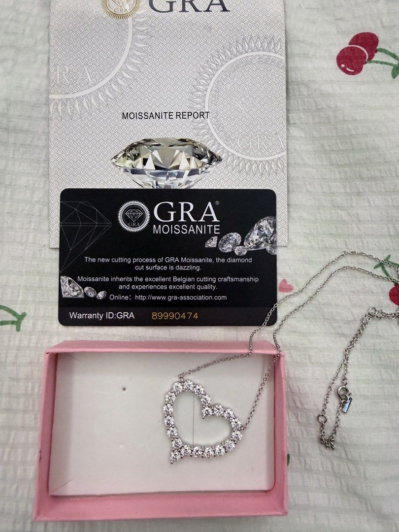 GRA Moissanite Heart Necklace with Report (Category: Necklaces) located in Tanza. Submitted by awesomeshopper (Listing ID 1467930948, Image 1). Description: - Stunning heart pendant necklace completely encrusted with sparkling GRA-certified moissanite stones - Crafted in high-quality silver with a delicate, thin chain and secure clasp closure - Comes complete with the official GRA moissanite report card (Warranty ID: 89990474) - Includes a charmi