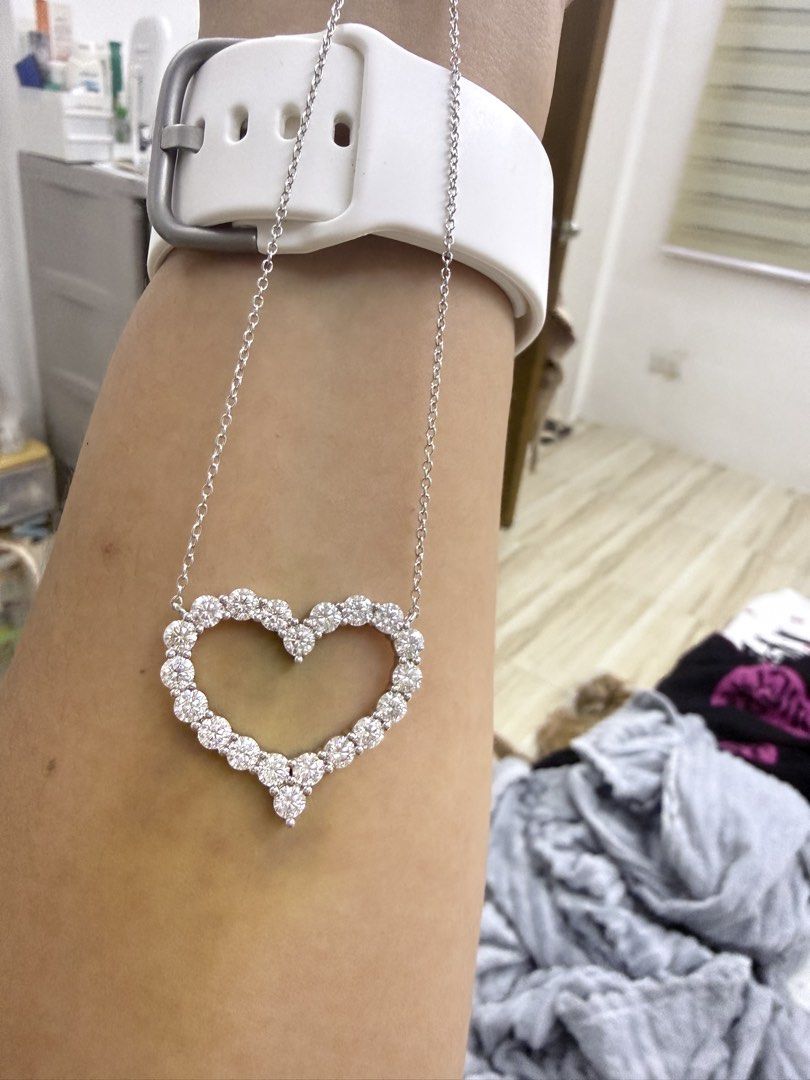 GRA Moissanite Heart Necklace with Report (Category: Necklaces) located in Tanza. Submitted by awesomeshopper (Listing ID 1467930948, Image 2). Description: - Stunning heart pendant necklace completely encrusted with sparkling GRA-certified moissanite stones - Crafted in high-quality silver with a delicate, thin chain and secure clasp closure - Comes complete with the official GRA moissanite report card (Warranty ID: 89990474) - Includes a charmi